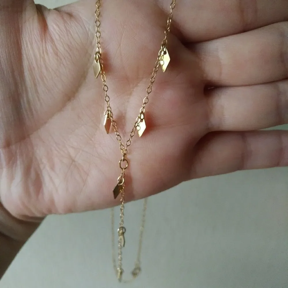 Choker style necklace with diamond♦ shaped accents